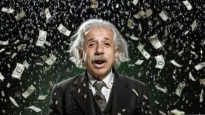 Money raining down on albert Einstein of money and coins against a dark background, wearing a suit and tie with a surprised expression.